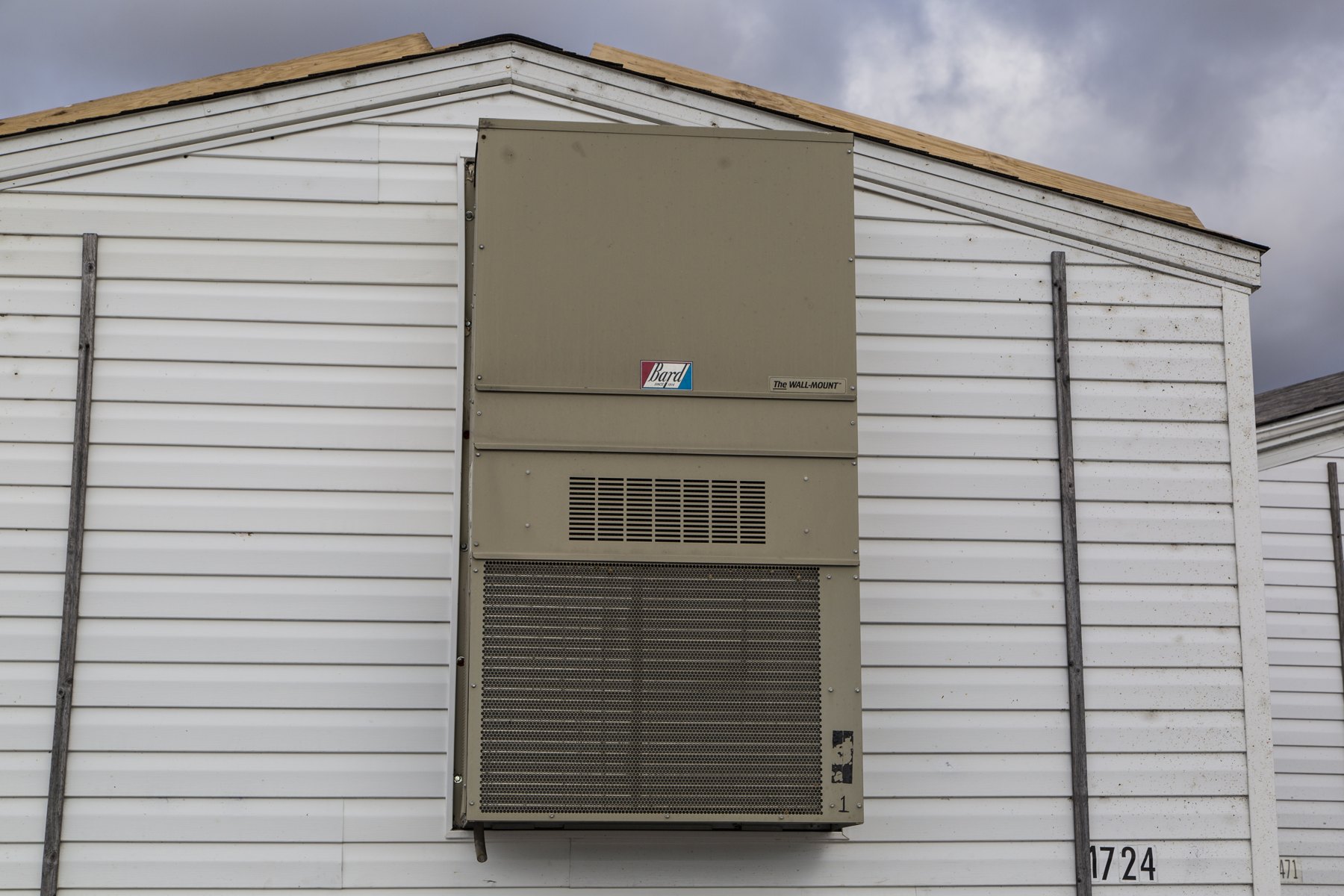 The end wall and HVAC unit of a manufactured home